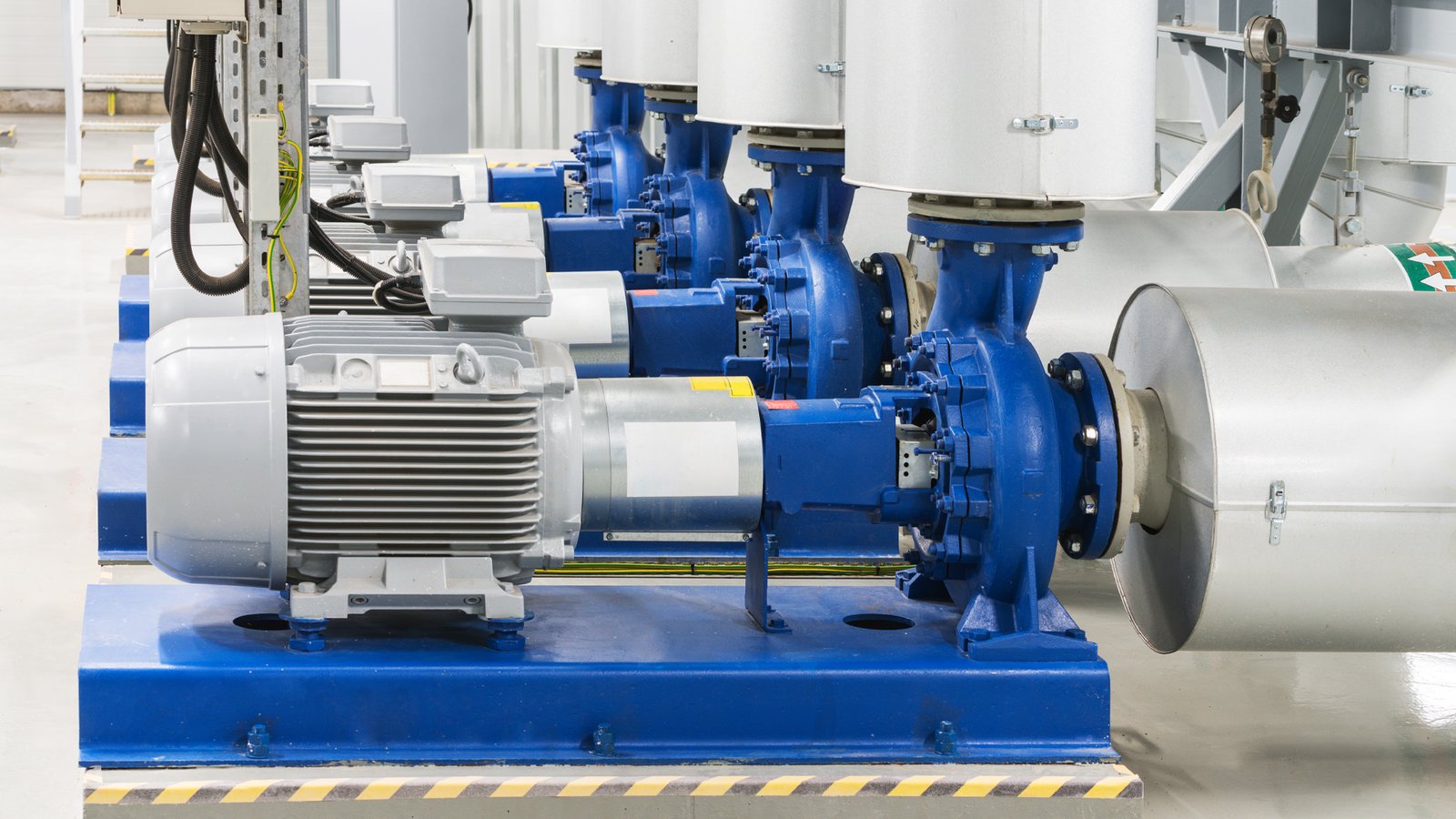 Industrial electric pumps and motors installed in a pump room